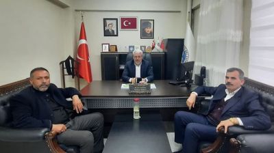 Ekinözü Belediye Başkanı Bilal Eker, MHP İlçe Başkanı İsrafil Biçer'i makamında ağırladı